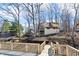 Waterfront home with lakeside docks and lush trees, providing a serene and natural setting at 6198 Grosbeak Dr, Nineveh, IN 46164
