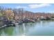 Scenic view of a lakefront property with a private dock and serene water views on a bright, sunny day at 6198 Grosbeak Dr, Nineveh, IN 46164