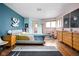 Bedroom with hardwood floors, pastel walls, decor and a colorful quilt on the bed at 6461 Sunset Ln, Indianapolis, IN 46260
