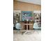 Stylish dining area with unique decor, modern furniture, and bright, airy atmosphere at 6461 Sunset Ln, Indianapolis, IN 46260