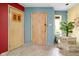 Colorful entryway featuring unique tile flooring and vintage decor with plant accents at 6461 Sunset Ln, Indianapolis, IN 46260