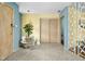 Bright foyer featuring unique flooring, vibrant walls, retro divider, and vintage decor at 6461 Sunset Ln, Indianapolis, IN 46260