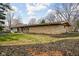 Expansive ranch-style home featuring a stone facade and beautifully landscaped yard at 6461 Sunset Ln, Indianapolis, IN 46260