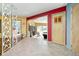 Retro hallway featuring stylish room divider, a view of the dining room, and open layout at 6461 Sunset Ln, Indianapolis, IN 46260