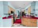 Vintage-style kitchen with red countertops, light blue walls, and modern appliances at 6461 Sunset Ln, Indianapolis, IN 46260