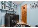 Laundry room with modern washer/dryer and ample shelving for organized storage at 6461 Sunset Ln, Indianapolis, IN 46260
