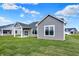 A large backyard with lush green grass and newly constructed homes in a residential area at 7158 Rose Hill Ave, Brownsburg, IN 46112