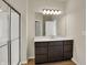 Modern bathroom featuring a large vanity with dark wood cabinets and a glass shower at 7158 Rose Hill Ave, Brownsburg, IN 46112