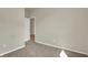 Neutral-toned bedroom with wall to wall carpeting, a window, and an open doorway at 7158 Rose Hill Ave, Brownsburg, IN 46112