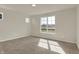 Cozy bedroom with plush carpeting, a large window offering ample natural light, and neutral wall color at 7158 Rose Hill Ave, Brownsburg, IN 46112