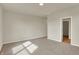Spacious carpeted bedroom with closet, neutral walls, and a view into a walk-in closet at 7158 Rose Hill Ave, Brownsburg, IN 46112