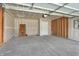 Spacious two-car garage with concrete floor and ready for your vehicles and storage at 7158 Rose Hill Ave, Brownsburg, IN 46112