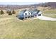 Overhead view featuring a farmhouse with wraparound porch, pool, and fenced yard at 7418 W Old Sr 252, Edinburgh, IN 46124