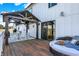 Charming back deck features a gazebo with string lights, comfortable furniture, and a grill at 7418 W Old Sr 252, Edinburgh, IN 46124