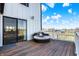 Cozy back deck featuring a gazebo with string lights, a lounge chair, and sliding glass doors at 7418 W Old Sr 252, Edinburgh, IN 46124
