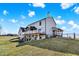 Expansive backyard featuring a deck with a gazebo, a walkout basement, and green grass at 7418 W Old Sr 252, Edinburgh, IN 46124