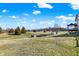 Wide view of backyard with pool, shed, and trees and partial view of house at 7418 W Old Sr 252, Edinburgh, IN 46124