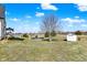Wide view of backyard with pool, shed, and trees at 7418 W Old Sr 252, Edinburgh, IN 46124