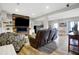 Finished basement featuring a modern fireplace with wood accent wall, built-in shelving, and a large screen television at 7418 W Old Sr 252, Edinburgh, IN 46124