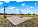Outdoor basketball court with hoop and lighting, perfect for recreation and sports at 7418 W Old Sr 252, Edinburgh, IN 46124