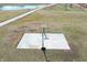 Aerial view of a basketball court near a large pond and farmhouse at 7418 W Old Sr 252, Edinburgh, IN 46124