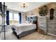 Teenage bedroom with skateboard decor, wood accent wall, and a large window at 7418 W Old Sr 252, Edinburgh, IN 46124