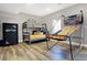 Bedroom featuring bunk beds, a full-size safe, and a basketball arcade game offering space for fun and games at 7418 W Old Sr 252, Edinburgh, IN 46124