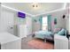 bedroom featuring modern furniture, television, and a large window at 7418 W Old Sr 252, Edinburgh, IN 46124