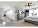 Open-concept main bedroom with closet, gray furnishings, ceiling fan, large windows with natural light, and neutral colors at 7418 W Old Sr 252, Edinburgh, IN 46124