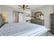Well-lit primary bedroom featuring a sliding barn door leading to the ensuite bathroom and a stylish gray dresser at 7418 W Old Sr 252, Edinburgh, IN 46124