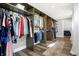 Spacious walk-in closet with ample hanging space, built-in shelving, and a neutral color palette for organized storage at 7418 W Old Sr 252, Edinburgh, IN 46124