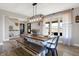 Bright dining room featuring a large table with bench seating and stylish light fixture at 7418 W Old Sr 252, Edinburgh, IN 46124