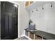Mud room with black door, coat hooks, storage bench, and cubbies at 7418 W Old Sr 252, Edinburgh, IN 46124