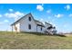 Exterior view of the home showcasing the architecture and spacious backyard at 7418 W Old Sr 252, Edinburgh, IN 46124