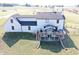 Beautiful backyard view of home featuring a wooden deck, manicured lawn, and a fenced perimeter at 7418 W Old Sr 252, Edinburgh, IN 46124