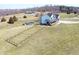 Farmhouse with covered porch, above-ground pool, and fenced area at 7418 W Old Sr 252, Edinburgh, IN 46124