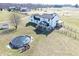 Aerial view of a modern farmhouse with pool, deck, and large lawn on a sunny day at 7418 W Old Sr 252, Edinburgh, IN 46124