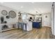 Modern kitchen with white cabinets, stainless steel appliances, and a center island with seating at 7418 W Old Sr 252, Edinburgh, IN 46124