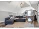 Cozy living area with sectional sofa, vaulted ceilings, stylish decor, and bright natural light from the window at 7418 W Old Sr 252, Edinburgh, IN 46124