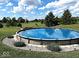 Inviting above ground pool with surrounding green space and landscaping at 7418 W Old Sr 252, Edinburgh, IN 46124