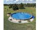 Well-maintained above ground pool with ladder surrounded by lush green lawn at 7418 W Old Sr 252, Edinburgh, IN 46124