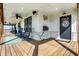 Charming covered porch with rocking chairs, decorative accents, and a welcoming front door at 7418 W Old Sr 252, Edinburgh, IN 46124
