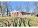 Home with brick exterior and a well-maintained yard, offering a serene outdoor space at 7953 Forest Park Dr, Indianapolis, IN 46217