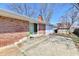 The house features a brick exterior with a patio perfect for outdoor entertaining at 7953 Forest Park Dr, Indianapolis, IN 46217