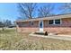 The house features a brick exterior with a patio perfect for outdoor entertaining at 7953 Forest Park Dr, Indianapolis, IN 46217