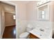 Well-lit bathroom with a vanity, tiled walls, and a clean, classic design at 7953 Forest Park Dr, Indianapolis, IN 46217