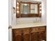 Bathroom featuring a vanity with an integrated sink and wooden cabinetry at 7953 Forest Park Dr, Indianapolis, IN 46217