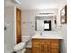 Bathroom featuring a wood vanity, linoleum floors, and a shower with tile surround at 7953 Forest Park Dr, Indianapolis, IN 46217