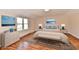Well-lit bedroom with hardwood floors, ample natural light, and a comfortable bed at 7953 Forest Park Dr, Indianapolis, IN 46217