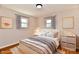 Cozy bedroom with natural light, hardwood floors, and tasteful decor at 7953 Forest Park Dr, Indianapolis, IN 46217